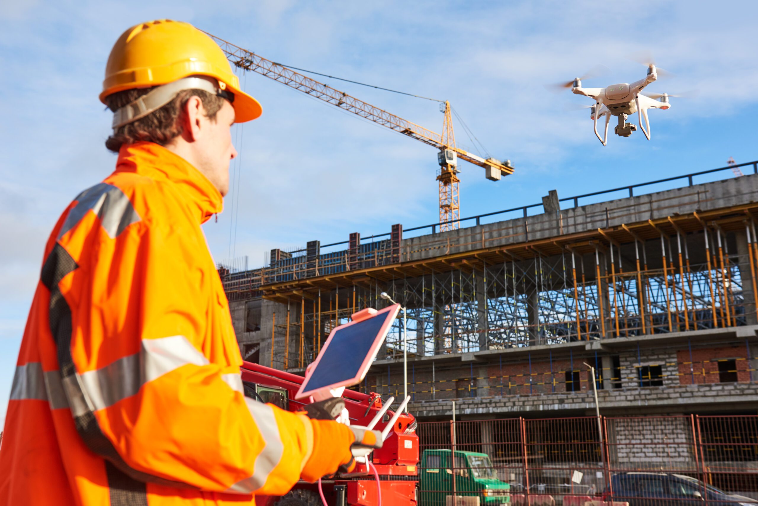 Drone operated by construction worker on building site